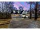 Charming two-story home with blue siding, stone accents, dormer windows and attached two-car garage at 1931 Amber Dawn Way, Lawrenceville, GA 30043