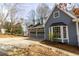 Stylish two-story home with a stone-accented garage, bay window and blue horizontal siding at 1931 Amber Dawn Way, Lawrenceville, GA 30043