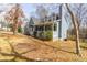 Inviting two-story home with a covered front porch, stone chimney, and well-maintained lawn at 1931 Amber Dawn Way, Lawrenceville, GA 30043