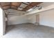 A large, bright garage with an automatic door, a concrete floor, and ample storage room at 1931 Amber Dawn Way, Lawrenceville, GA 30043