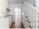 Hallway features stairs and wet bar with granite counters and storage at 1931 Amber Dawn Way, Lawrenceville, GA 30043