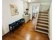 Staircase with hardwood floors and a nearby wet bar offers functionality at 1931 Amber Dawn Way, Lawrenceville, GA 30043