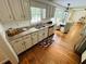 Updated kitchen with granite countertops, white cabinets, and stainless steel appliances at 1931 Amber Dawn Way, Lawrenceville, GA 30043
