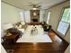 Bright living room featuring hardwood floors, stone fireplace and many windows at 1931 Amber Dawn Way, Lawrenceville, GA 30043