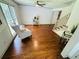 Bright living room with hardwood floors, white armchair, and plenty of natural light at 1931 Amber Dawn Way, Lawrenceville, GA 30043