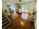 Hardwood floors and natural light in this living room create a warm and inviting space at 1931 Amber Dawn Way, Lawrenceville, GA 30043