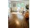 Hardwood floors and two elegant armchairs grace the naturally illuminated living room at 1931 Amber Dawn Way, Lawrenceville, GA 30043