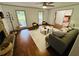 Spacious living room with a stone fireplace and open floor plan at 1931 Amber Dawn Way, Lawrenceville, GA 30043