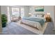 Bright main bedroom featuring a bay window, artwork, and neutral decor at 1931 Amber Dawn Way, Lawrenceville, GA 30043