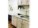 Convenient wet bar offering storage and serving area, paired with stylish bar stools at 1931 Amber Dawn Way, Lawrenceville, GA 30043