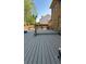 Backyard area featuring a spacious wooden deck and lush landscaping at 1932 River Crest Way, Lawrenceville, GA 30045