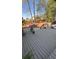 Large backyard deck with railing and stairs, ideal for outdoor gatherings at 1932 River Crest Way, Lawrenceville, GA 30045