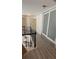 Upstairs hallway featuring hardwood floors and white paneled closet doors at 1932 River Crest Way, Lawrenceville, GA 30045