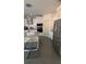 Modern kitchen with stainless steel appliances, granite countertops, and a large island for gathering at 1932 River Crest Way, Lawrenceville, GA 30045