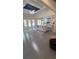 Bright open floor plan living area with gray sofa and area rug at 1932 River Crest Way, Lawrenceville, GA 30045
