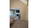 Spacious primary bedroom leading to a relaxing sitting area, featuring a cozy fireplace and bright windows at 1932 River Crest Way, Lawrenceville, GA 30045