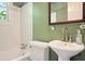 Bathroom showcasing a vintage sink, toilet, bathtub, and window offering natural light at 242 12Th Ne St # 1A, Atlanta, GA 30309
