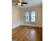 Bedroom with hardwood floors, neutral paint, and window bringing in natural light at 242 12Th Ne St # 1A, Atlanta, GA 30309