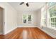Bright bedroom featuring hardwood floors, large windows, and a ceiling fan at 242 12Th Ne St # 1A, Atlanta, GA 30309