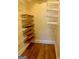 Walk-in closet with wood and wire shelving offering ample storage space at 242 12Th Ne St # 1A, Atlanta, GA 30309