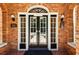 Close up of grand front door with transom and sidelights, as well as address plaque at 242 12Th Ne St # 1A, Atlanta, GA 30309