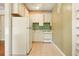 Compact kitchen with white cabinets and appliances at 242 12Th Ne St # 1A, Atlanta, GA 30309