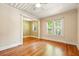 Well-lit living room featuring hardwood floors and neutral paint scheme at 242 12Th Ne St # 1A, Atlanta, GA 30309