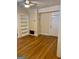 Living room features hardwood floors, built-in bookshelves, and neutral paint scheme at 242 12Th Ne St # 1A, Atlanta, GA 30309