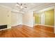 Living room with hardwood floors, built-in shelving, and neutral paint at 242 12Th Ne St # 1A, Atlanta, GA 30309
