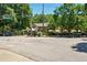 Street view highlighting the neighborhood setting near a park and local shops or businesses at 242 12Th Ne St # 1A, Atlanta, GA 30309