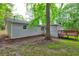 The backyard features a deck attached to the house and a large tree at 3963 Holland Ct, Douglasville, GA 30135