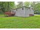 Backyard with a wood deck and the house siding painted gray at 3963 Holland Ct, Douglasville, GA 30135