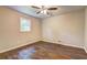 This bedroom features neutral walls, hardwood floors, and a window at 3963 Holland Ct, Douglasville, GA 30135