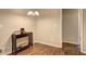 Cozy dining area with hardwood floors and a charming chandelier, perfect for intimate meals at 3963 Holland Ct, Douglasville, GA 30135