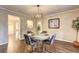 Dining room features hardwood floors, chandelier, and flows into other living spaces at 3963 Holland Ct, Douglasville, GA 30135