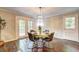 Dining room area showcasing a chandelier and access to the patio at 3963 Holland Ct, Douglasville, GA 30135