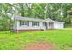 Exterior of the home with the garage attached and a small front porch at 3963 Holland Ct, Douglasville, GA 30135
