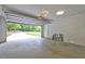 The garage features concrete floors, white walls, and the door open to the driveway at 3963 Holland Ct, Douglasville, GA 30135