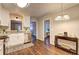 Bright eat-in kitchen features granite countertops, stainless steel appliances, and hardwood flooring at 3963 Holland Ct, Douglasville, GA 30135