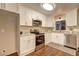 Bright kitchen boasts white cabinets, stainless steel appliances, and granite countertops at 3963 Holland Ct, Douglasville, GA 30135