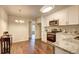 Updated kitchen features white cabinets, stainless steel appliances, and stylish granite countertops at 3963 Holland Ct, Douglasville, GA 30135