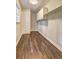 This laundry room has wood floors, a window, cabinets, and shelves at 3963 Holland Ct, Douglasville, GA 30135