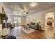 Bright living room showcasing a fireplace and hardwood floors flowing into an updated kitchen at 3963 Holland Ct, Douglasville, GA 30135