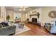 Inviting living room featuring hardwood floors, neutral paint, and a cozy fireplace at 3963 Holland Ct, Douglasville, GA 30135