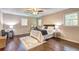 Spacious main bedroom with a ceiling fan, hardwood floors, and comfortable furnishings at 3963 Holland Ct, Douglasville, GA 30135