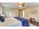 Bedroom featuring a walk-in closet, ceiling fan, and hardwood floors at 3963 Holland Ct, Douglasville, GA 30135