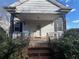 Inviting front porch with ornate railings, perfect for relaxing outdoors at 5111 Newark Ave, Clarkdale, GA 30111