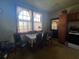 Functional kitchen featuring wood cabinets, linoleum flooring, and a casual dining area at 5111 Newark Ave, Clarkdale, GA 30111