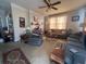 Spacious living room featuring neutral carpet, ample seating, and bright natural light at 5111 Newark Ave, Clarkdale, GA 30111