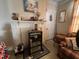 Cozy living room featuring a fireplace, a decorative mantel, and a comfortable armchair at 5111 Newark Ave, Clarkdale, GA 30111